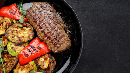 Juicy steak and grilled vegetables, with spices