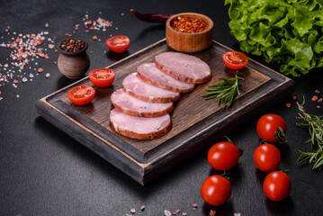 Delicious fresh ham cut with slices on a wooden cutting board