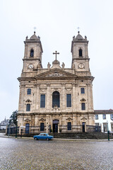 Fototapeta na wymiar Porto, Portugal: Retro blue car in front of the church of Our Lady of Lapa