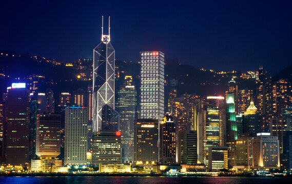 High angle view of a city lit up at night, Hong Kong, China