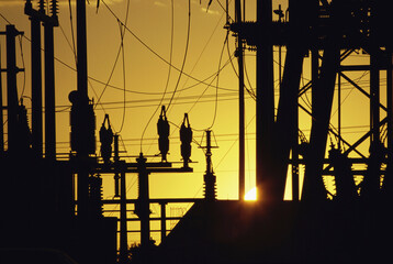 Silhouette of electric power pylons