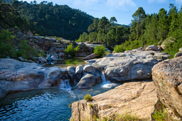 The Cavu river and its natural pools. Piscines Naturelles De Cavu are natural swimming pools formed by river Cavu, Corse du Sud, Corsica, France - obrazy, fototapety, plakaty