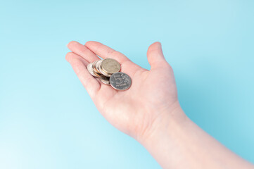 Woman hand with russian coins. Hand with money. Budget.