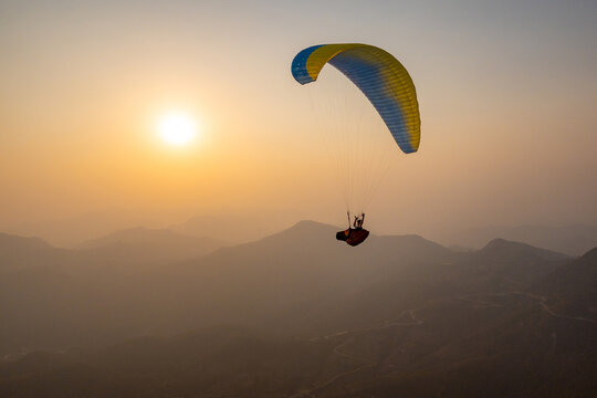 Paragliding in Pokhara, Nepal at sunset