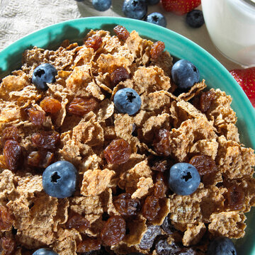 Close-up of corn flakes with blueberries in a bowl