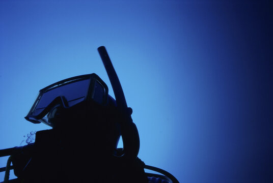 Silhouette of a scuba diver