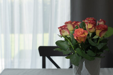 Home simple decoration with fresh bouquet of roses in a vase