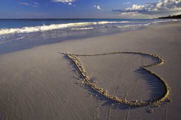 Heart drawn on the sand at a beach in Mexico
