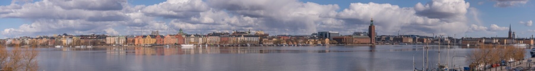 Panorama view at the bay Riddarfjärden and the down town buildings with the Town City Hall and a part of the old town Gamla Stan a sunny spring day in Stockholm