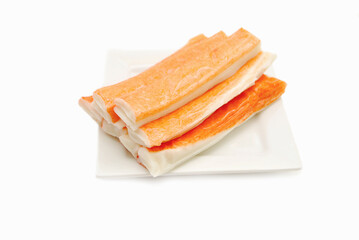 Imitation Crab Meat on a Small White Plate
