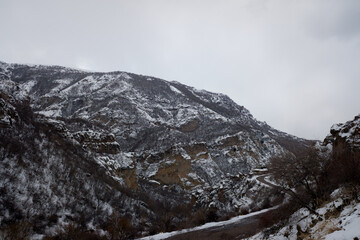 mountain road among snow-capped mountain peaks