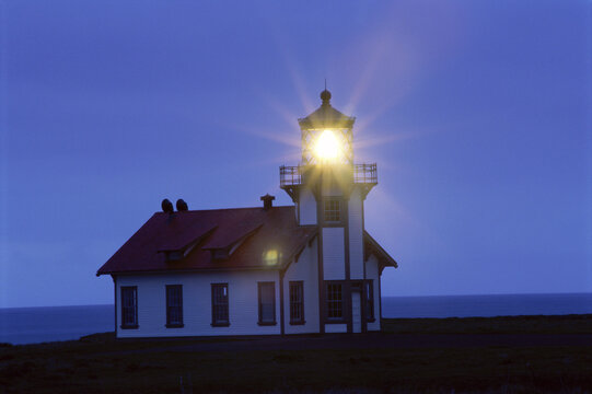 Light shining from Point Cabrillo Lighthouse, Mendocino, California, USA