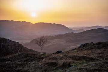 Sunset over the lake district mountains