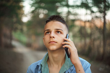 photo boy with a mobile phone in various poses, the concept of modern life