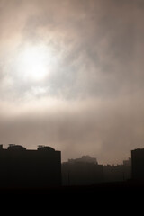 Fototapeta na wymiar a multi-storey residential block during fog
