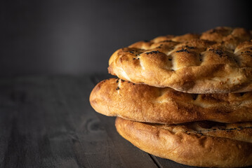 Ramadan Pita (Ramazan Pidesi). Traditional Turkish bread for holy month Ramadan. Side view and copy space.