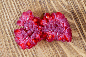 red ripe raspberries crushed into pieces