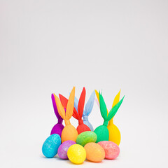 Colorful Easter bunnies paper gift eggs wrapping diy idea. Minimal Easter concept. With copy space.