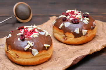freshly baked donuts on parchment paper close-up