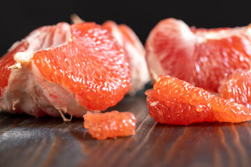 red ripe grapefruit on a cutting board