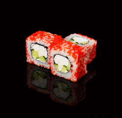 rolls on a black background with reflection