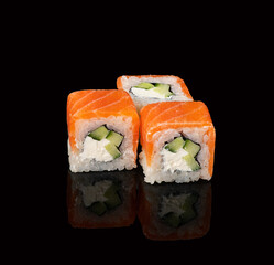 rolls on a black background with reflection