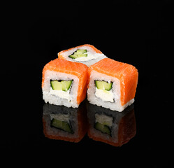 rolls on a black background with reflection