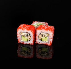 rolls on a black background with reflection