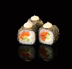 rolls on a black background with reflection