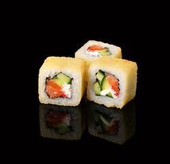 rolls on a black background with reflection