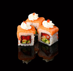 rolls on a black background with reflection