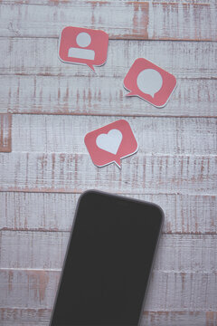 Social Media Concept Smart Phone with Paper Cut Icons in Speech Bubble
