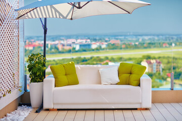 rooftop lounge area on the patio with beautiful view at sunny day