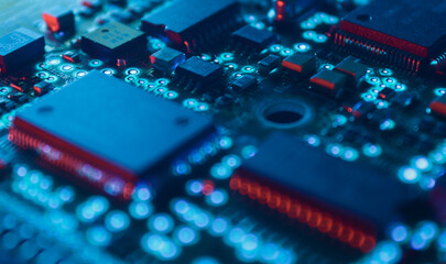 Computer Microchips and Processors on Electronic circuit board. Computer hardware technology. Abstract technology microelectronics concept background. Macro shot, shallow focus.