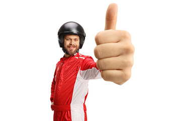 Driver in a red suit and helmet gesturing thumbs up