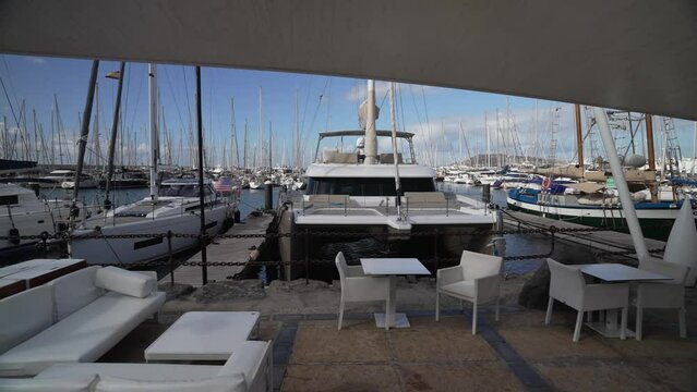 Cafe and boats in Rubicon Marina, Playa Blanca, Lanzarote, Canary Islands, Spain