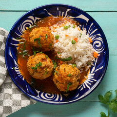 Meatballs with chipotle red sauce and rice. Mexican food