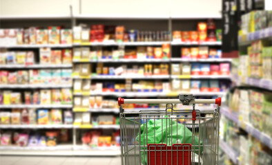 choosing a dairy products at supermarket.empty grocery cart in an empty supermarket