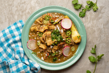 Meat in its juice is a stew with green sauce and steak. Mexican food