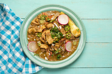 Meat in its juice is a stew with green sauce and steak. Mexican food