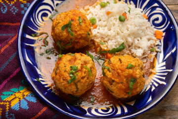 Meatballs with chipotle red sauce and rice. Mexican food