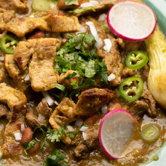 Meat in its juice is a stew with green sauce and steak. Mexican food