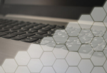 White glowing octagons with keyboard in background