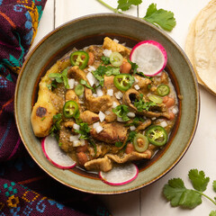 Meat in its juice is a stew with green sauce and steak. Mexican food