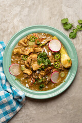 Meat in its juice is a stew with green sauce and steak. Mexican food