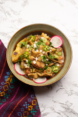 Meat in its juice is a stew with green sauce and steak. Mexican food