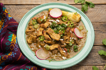 Meat in its juice is a stew with green sauce and steak. Mexican food