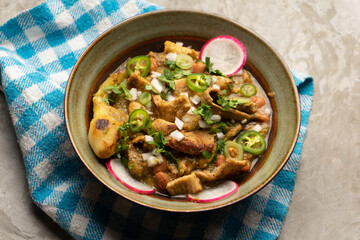 Meat in its juice is a stew with green sauce and steak. Mexican food