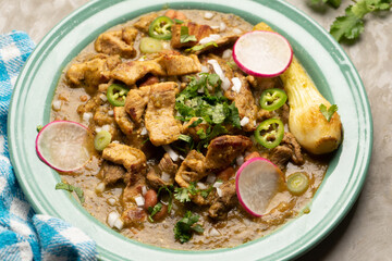 Meat in its juice is a stew with green sauce and steak. Mexican food