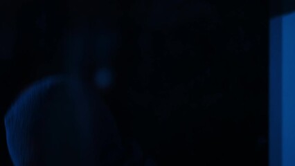 Close-up concentrated burglar with flashlight looking through window running away. Caught Caucasian man in mask failing breaking in house. Burglary failure concept